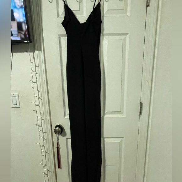 Just a plain black dress with a open leg slit. - Picture 3 of 4
